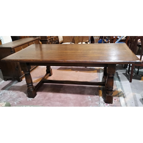 620 - A large Royal Oak distressed oak refectory dining table with rectangular top, on turned baluster leg... 