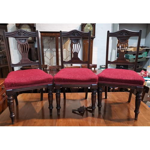 651 - An Edwardian set of 6 mahogany dining chairs with carved pierced splats, overstuffed seats in red br... 
