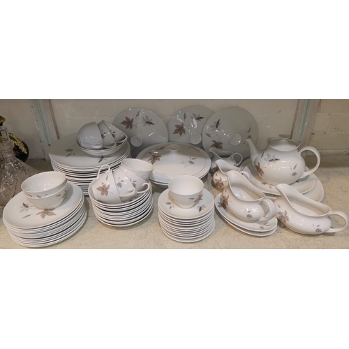 57 - A large selection of Royal Doulton Tumbling Leaves bone china dinner ware (approx. 100 pieces)