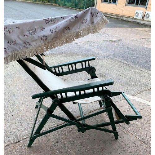 415 - A late 19th/early 20th century patented folding sunchair with cover, green painted