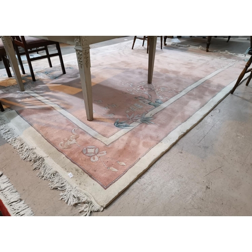 417 - A large Chinese carpet, pink ground with floral decoration in the Aubusson style, 146