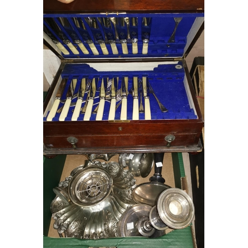 219 - A 1920's EPNS canteen of cutlery, an EPNS swing handle cake dish, a pair of candlesticks etc