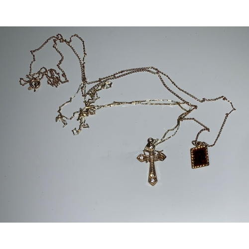 107 - A diamond and freshwater pearl pendant; a cross pendant on chain; a similar stamped '9K'