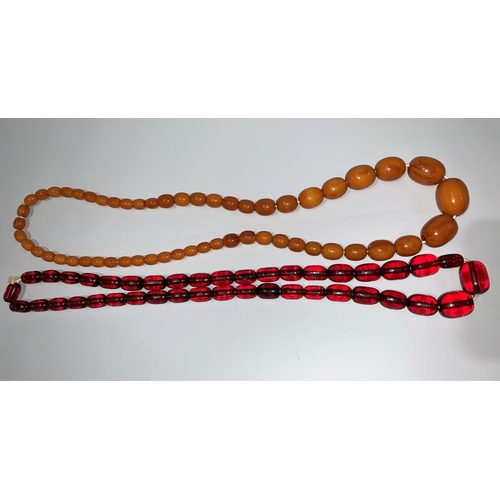 114 - A butterscotch amber coloured necklace; a cherry amber item; etc.
.butterscotch 58gm

cherry 54gm