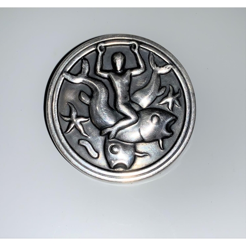 128 - A Georg Jensen silver circular brooch depicting a merman with 2 large fish and starfish, model No 28... 