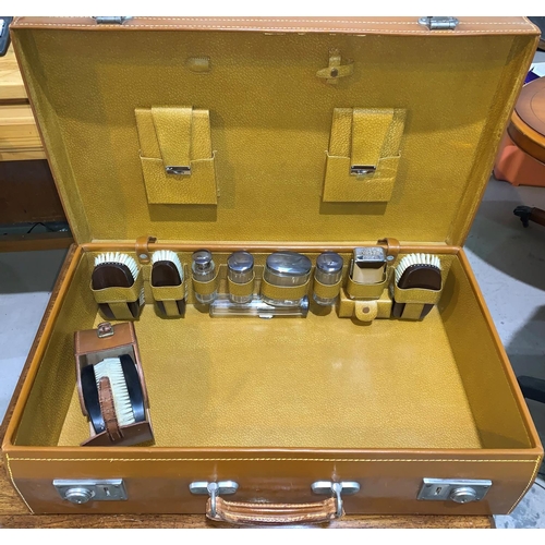 232a - A mid 20th century gents overnight case in brown leather, English made, fitted hallmarked silver top... 