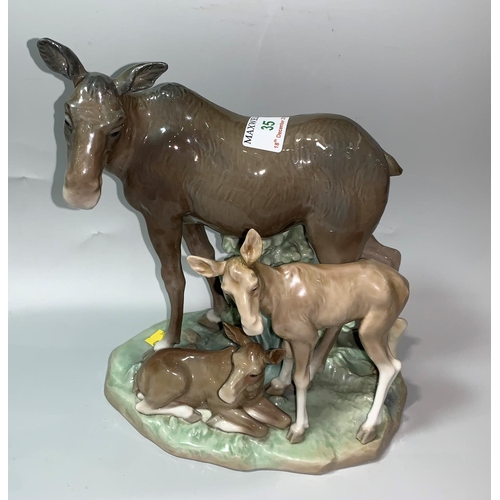 35 - A late 1970's / early 80's Lladro group of elk with 2 young by Salvador Furio (1 ear restored)