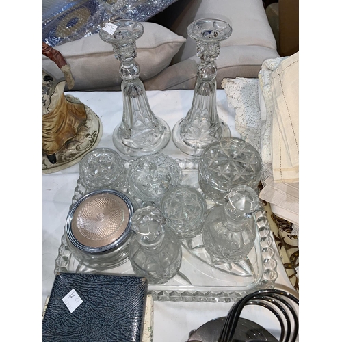 72a - A glass dressing table set; a selection of silver plated cutlery; a selection of table linen; other ... 