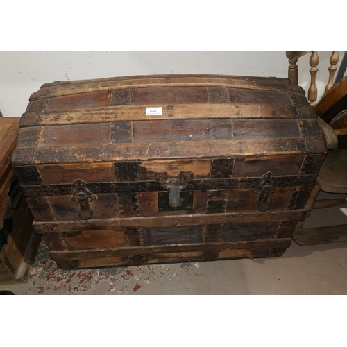 440 - A 19th century wood and metal bound chest with dome top and hide decoration