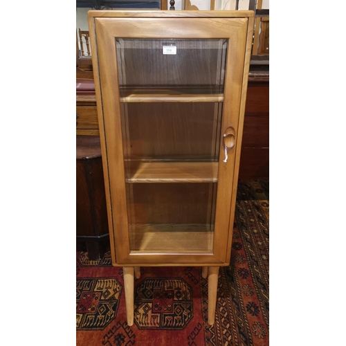 354 - An Ercol light elm display cabinet on later legs