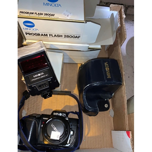 149b - A Minolta SLR 7000; 2 boxed lenses; other camera equipment