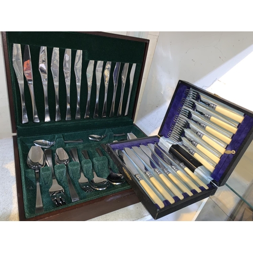 96a - A set of stainless steel cutlery in canteen; other cutlery