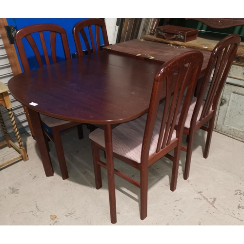 302 - A modern mahogany dining suite comprising extending table and 4 chairs