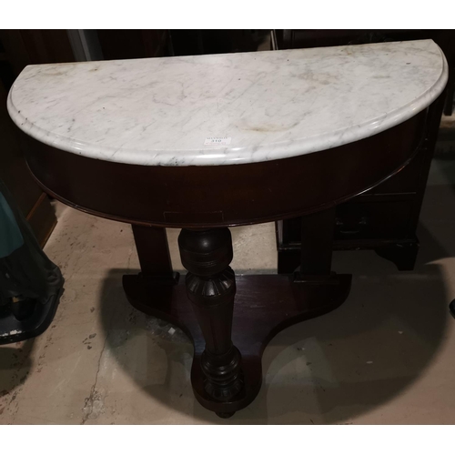 310 - A Victorian mahogany demi-lune washstand with marble top