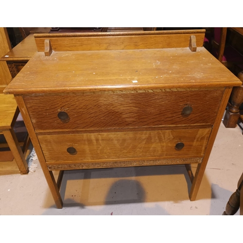 331 - Two 1930's oak 2 height chests of drawers; a bamboo shelf unit
