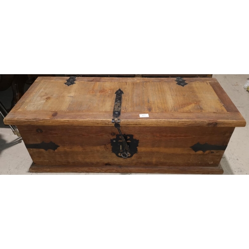 423 - A rustic pine chest with metal bindings