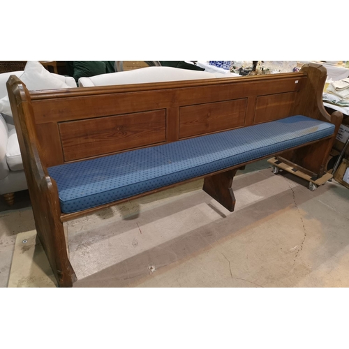 432 - A gothic carved pitch pine bench, 240 cm