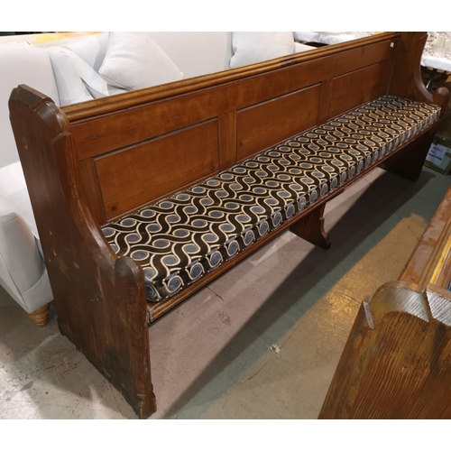 433 - A gothic carved pitch pine bench, 240 cm