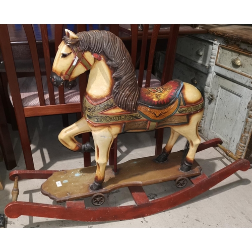 463 - An antique style rocking horse with fairground painted finish