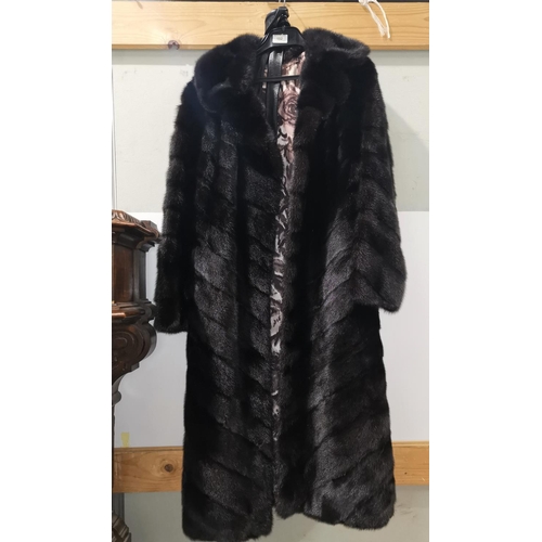 152 - A full length mink coat in black stripe effect