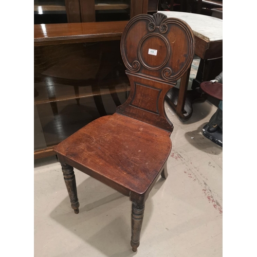 439 - A carved hall chair