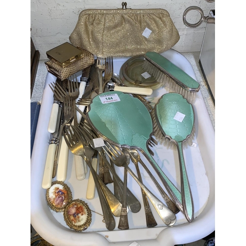 144 - A white metal and enamel 3 piece dressing table set; a purse; a selection of silver plate cutlery; e... 