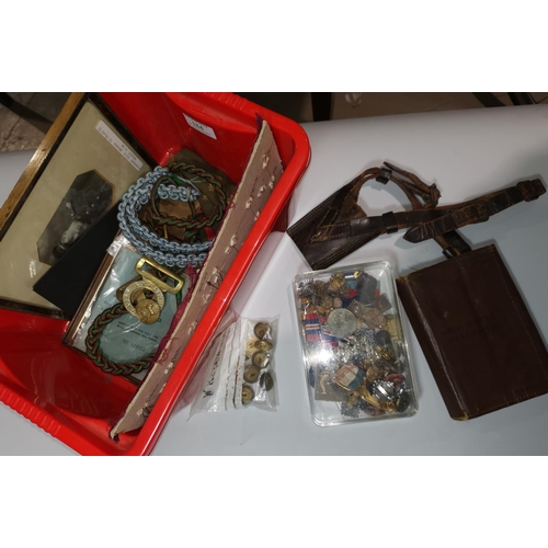 184 - A quantity of militaria including a 1914 field service book; lanyards; etc.