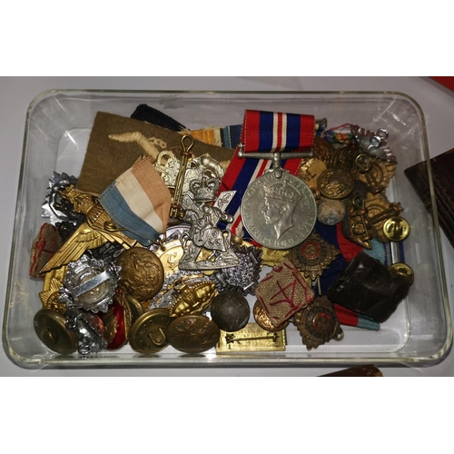184 - A quantity of militaria including a 1914 field service book; lanyards; etc.