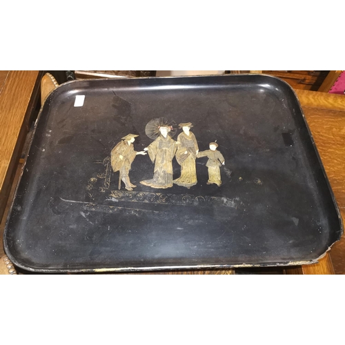 200 - An oriental lacquer work tray decorated in gilt with a family, length 24