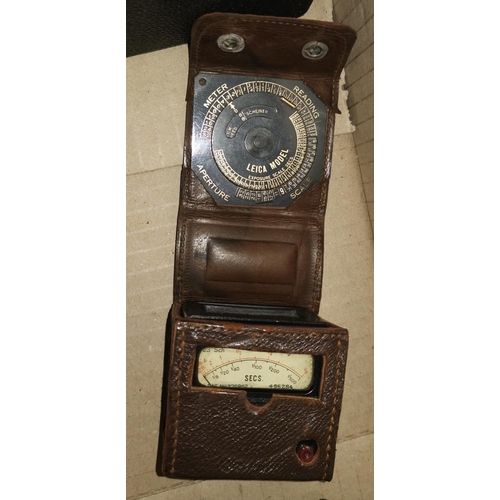 214 - An early Leica light meter; various cameras and collectables