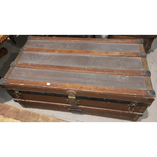 221 - A 19th century japanned metal hat box; a cabin trunk