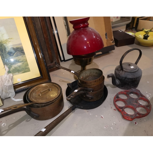 223 - A reproduction brass oil lamp; a selection of pewter; cast iron and copper pans; etc.