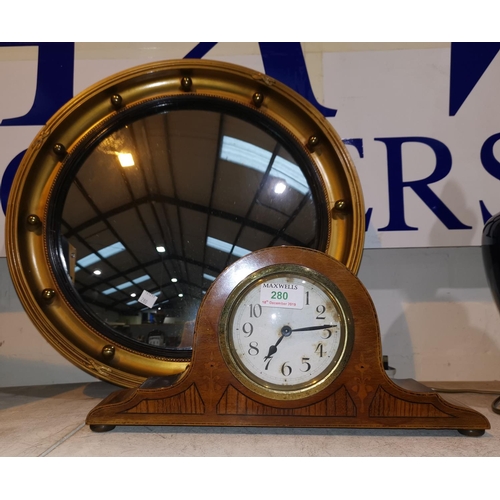 280 - An Edwardian mantel clock in inlaid mahogany case; a convex gilt ball wall mirror; brassware; orname... 