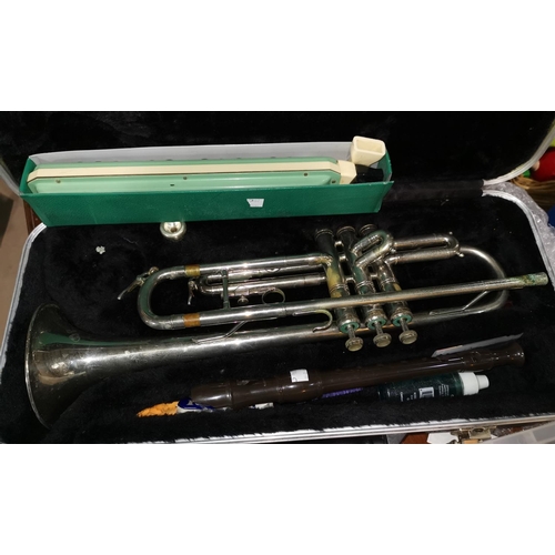 284c - A Lyle De Luxe trumpet, cased; 2 other instruments