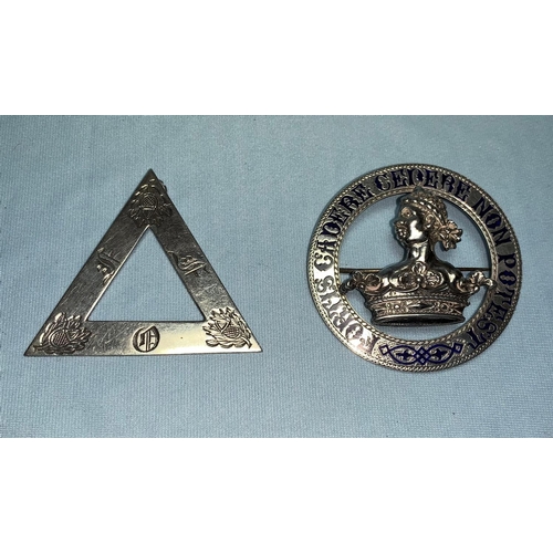 261 - An enamelled armorial badge 