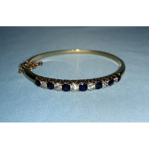 280 - A late Victorian yellow metal hinged bangle set 6 graduating diamonds and 7 sapphires, total diamond... 