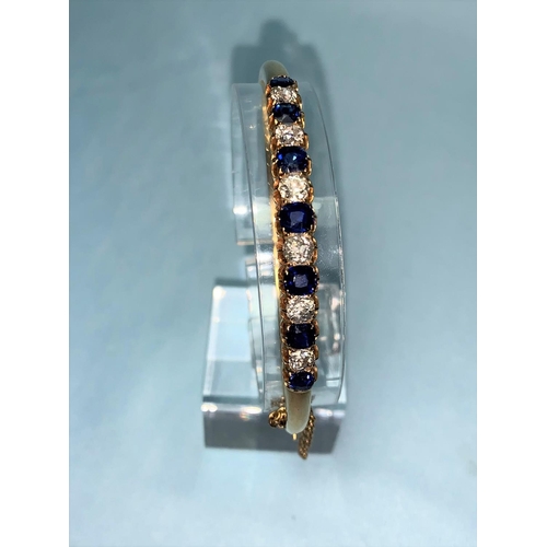 280 - A late Victorian yellow metal hinged bangle set 6 graduating diamonds and 7 sapphires, total diamond... 