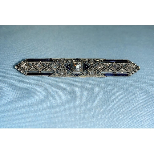282 - An Art Deco period white metal bar brooch, geometric design set with calibre cut synthetic sapphires... 