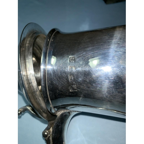 365 - An early George III lidded silver tankard with tapering pedestal foot, the domed hinged cover with m... 