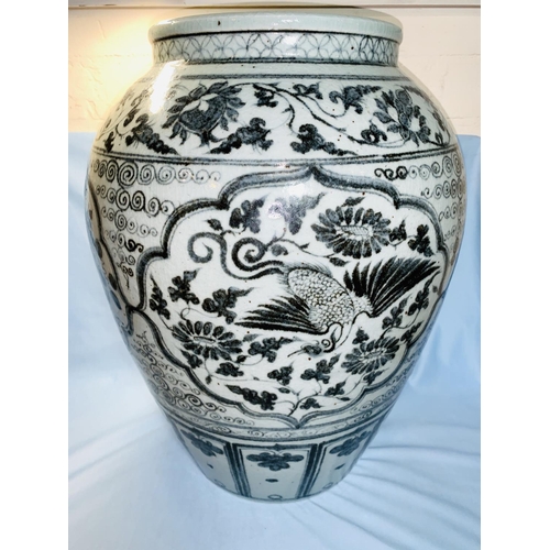 211 - A 20th century Chinese large ovoid vase, crackle glaze decorated with flowers and birds in underglaz... 
