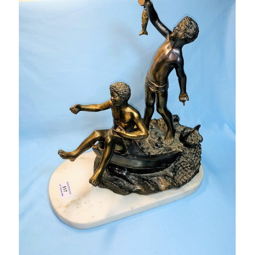 517 - A gilded spelter figure:  2 boys on a boat fishing, on white marble base, height 42 cm