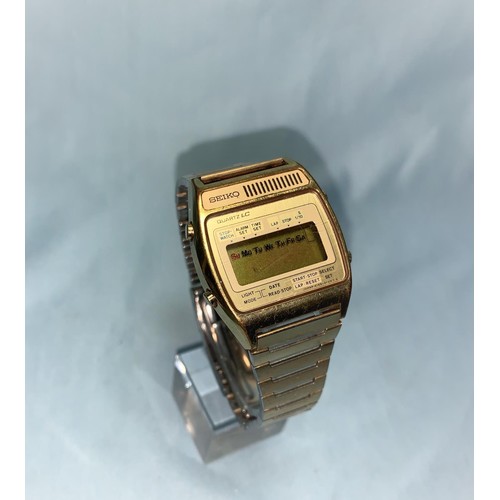 291a - A Seiko Quartz LC electronic wristwatch in gilt, numbered 860001, A159-4039G, in original box