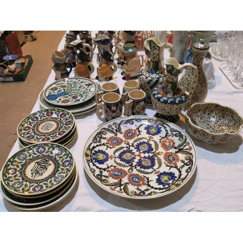 186 - A large selection of Turkish/Middle Eastern decorative pottery:  chargers; vases; jugs; plates; etc.... 