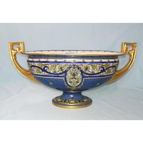 194 - A Royal Worcester 2 handled oval pedestal bowl in gilt and powder blue, with floral scroll band deco... 