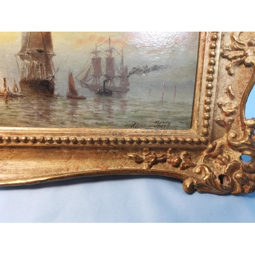 475 - Adolphus Knell ?:  oil on board, coastal sunset scene with shipping, signed, 11 x 30 cm, gilt framed