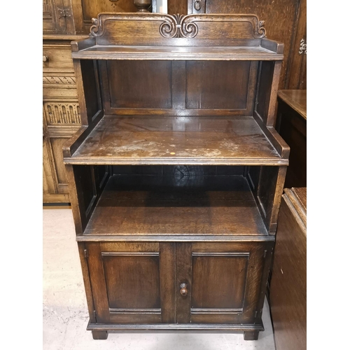 638 - A distressed oak side cabinet in the Titchmarsh & Goodwin style with 2 open shelves and double cupbo... 