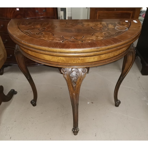 656 - A continental style 'D' shaped fold-over card table