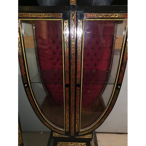 658 - A 19th century continental ebonised display cabinet with Biedermeier style boullework, shaped oval f... 