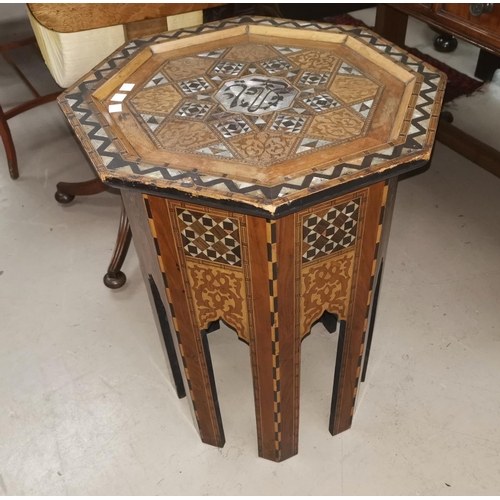 664 - A 19th century Middle Eastern octagonal occasional table with extensive mother-of-pearl and wood inl... 