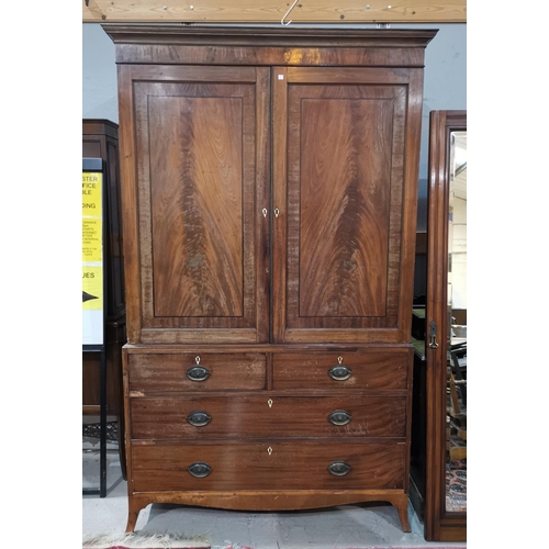 678 - A Georgian mahogany press cupboard, the upper section with 2 figured panel doors enclosing sliding t... 
